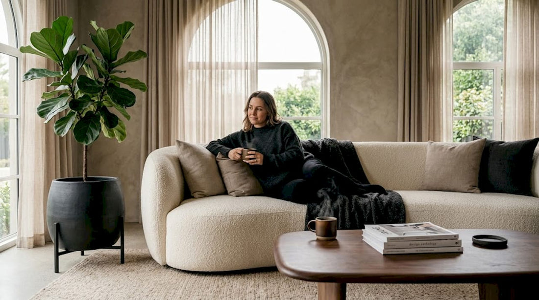 Modern living room with curved sofa and organic forms